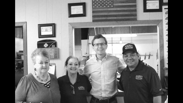 (From left to right) Local rancher Mary Williams, Janet Niehaus of Wall Meat Processing, Representative Dusty Johnson, and Ken Charfauros - owner of Wall Meat Processing.