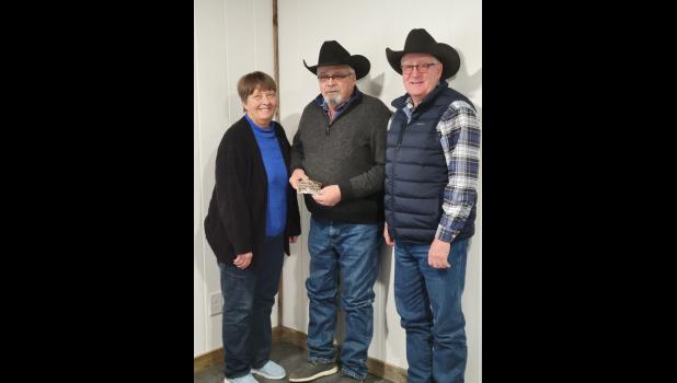 Cindy Kopren, Cindy’s Crop Insurance buckle sponsor, Bob Johnson, Mike Lemburg President of the SDQHRA.