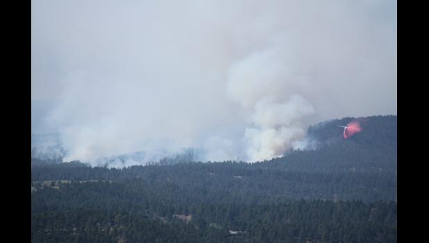 An airplane drops fire retardant chemicals near the First Thunder Fire just west of Rapid City on Sept. 3, 2024. Courtesy Seth Tupper/South Dakota Searchlight