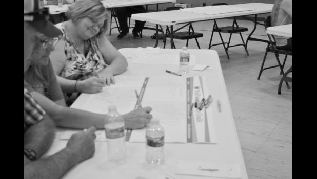 Members of the community lay out their ideas, and vision for the future of Wall at the Community Visioning Meeting.